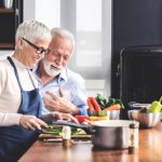 Image,Of,Beautiful,Senior,Couple,In,Aprons,Cooking,Vegetables,For